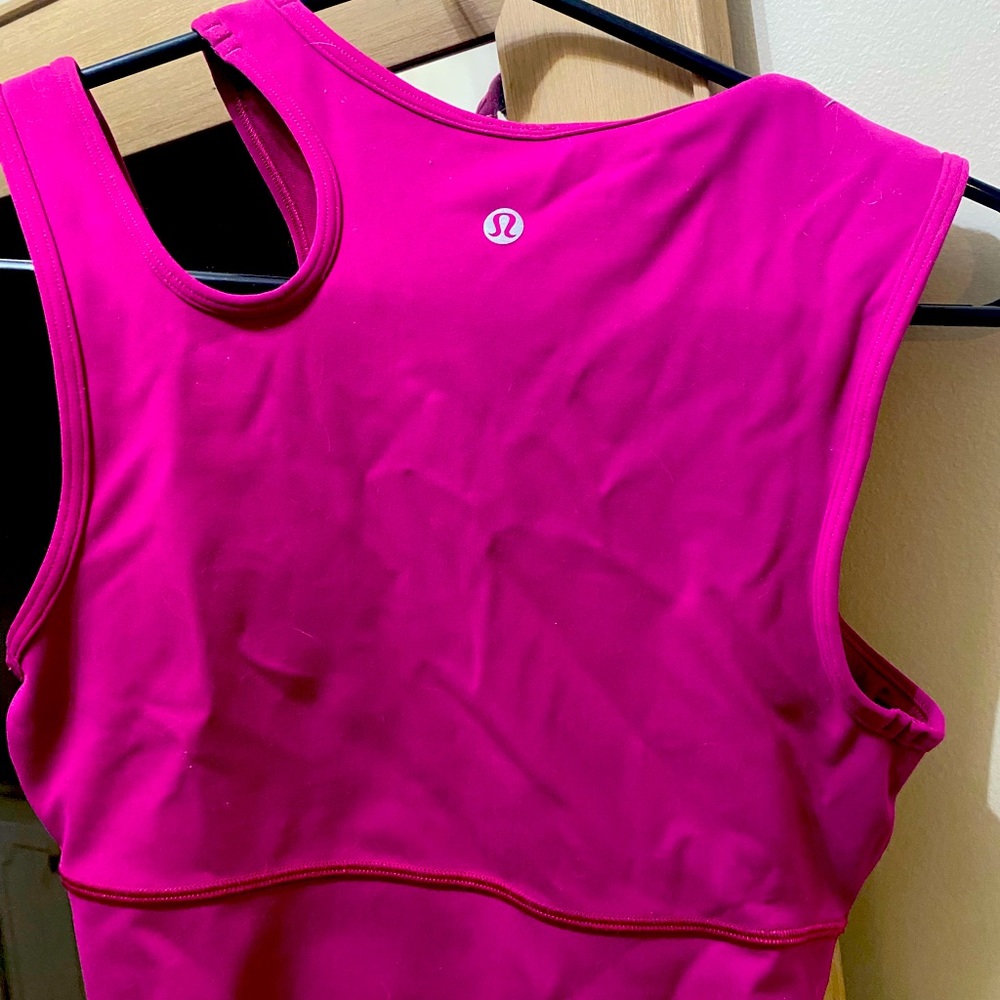 Unique LuLu athletic tank raspberry in color. Size 6 but fits like a 4.